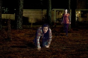 Liv Tyler attemptes to escape from one of the interlopers in The Strangers.